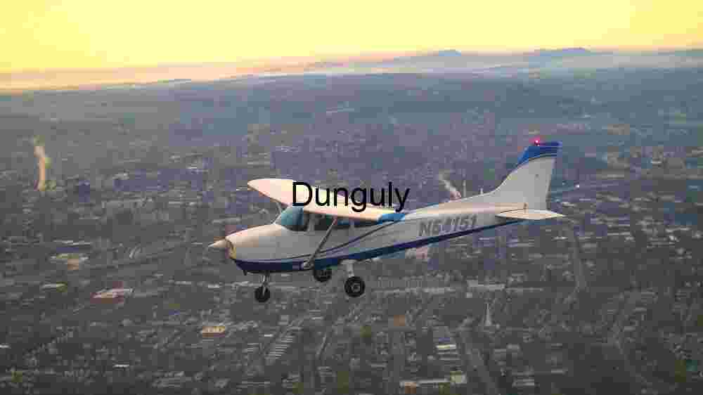 Small Aircraft Flying Over Cityscape at Sunset