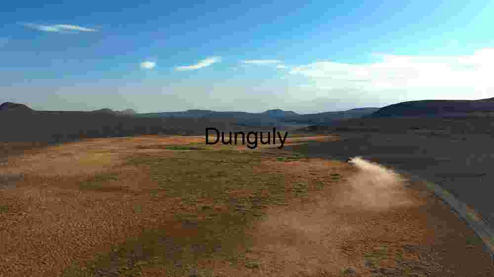 Desolate Road in a Vast Desert Landscape