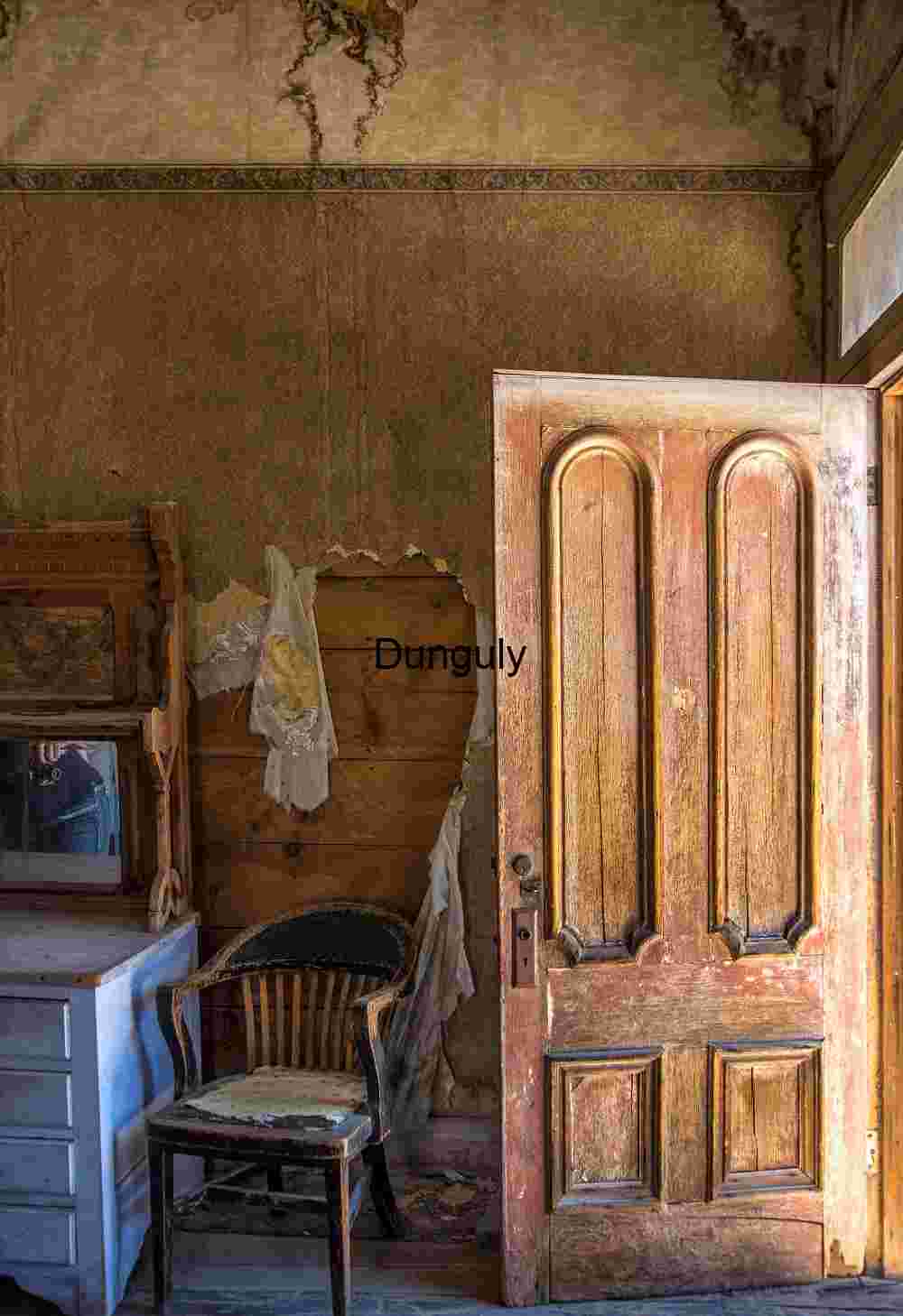 Abandoned Room with Open Door and Vintage Furniture