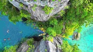 Aerial View of Kayakers and Swimmers in a Tropical Lagoon