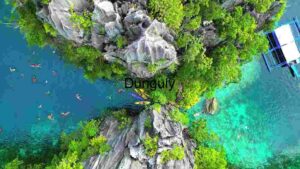 Aerial View of Kayakers & Swimmers in a Tropical Lagoon