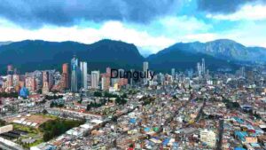 Aerial View of a Modern Urban Cityscape with Mountain Backdrop