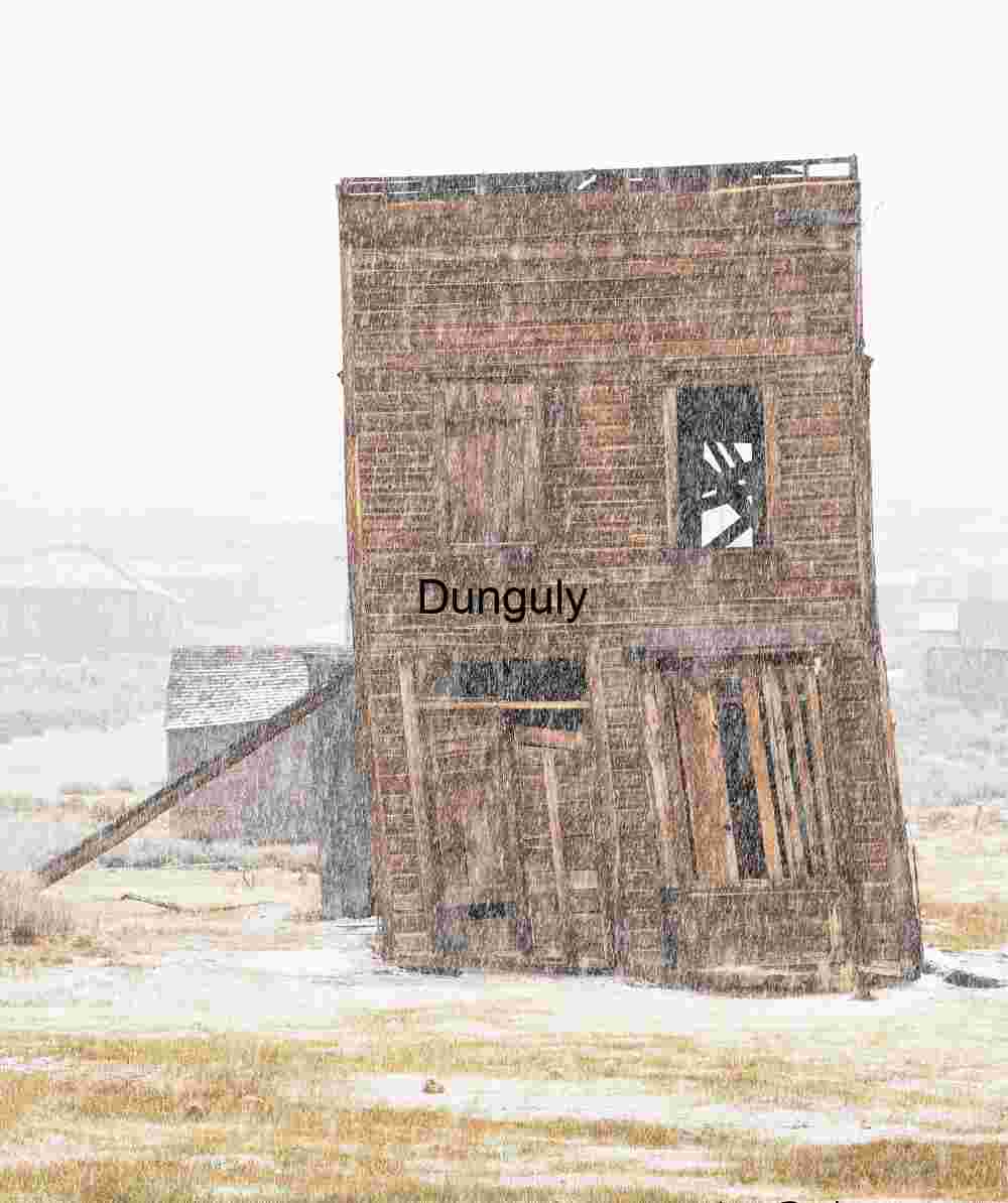 Abandoned Wooden Building in Snowstorm