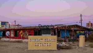 Graffiti-Covered Facade at Bombay Beach Estates During Sunset