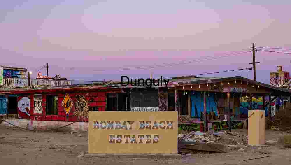 Graffiti-Covered Facade at Bombay Beach Estates During Sunset