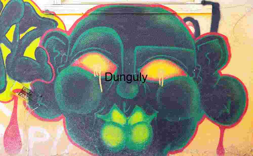 Green Face Graffiti with Glowing Eyes – Bombay Beach