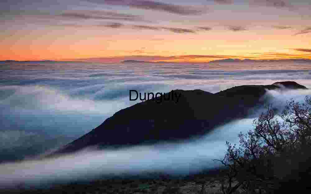 River of Clouds: Sunrise Over Mountain Silhouettes