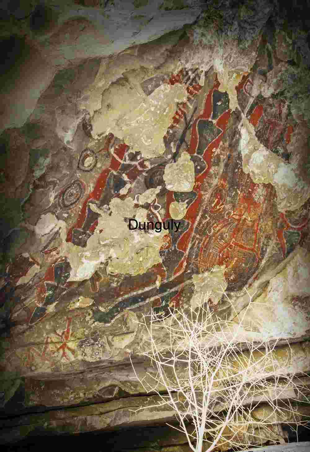 Ancient Symbols on Weathered Rock Overhang