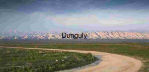 Winding Path to Solitude: Dirt Road Through Mountain Plains