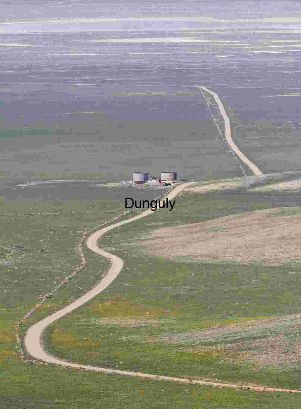 Silos in Solitude: Winding Road Through Transitional Plains