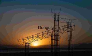 Sunset Silhouette: Abstract Structure Against Mountain Horizon