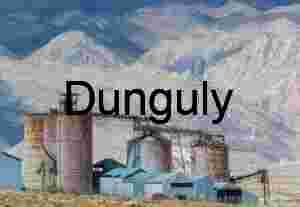 Rust‑Colored Industrial Silos in Mountainous Desert Landscape