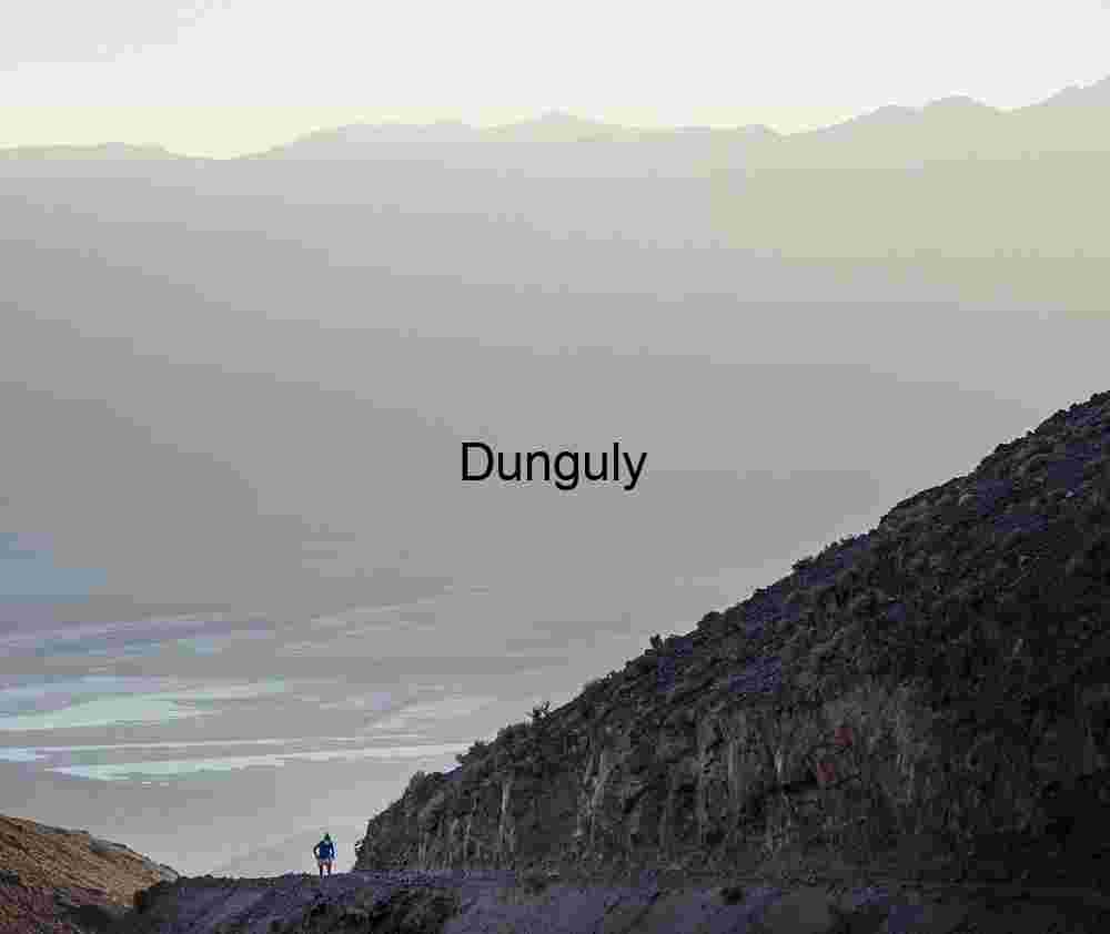 Hikers in Blue Overlooking Mountain Valley with Meandering Waterway
