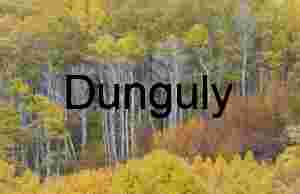 Sunlit Hills and Autumn Foliage Reflected in Serene Lake