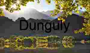 Sunlit Hills and Autumn Foliage Reflected in Serene Lake