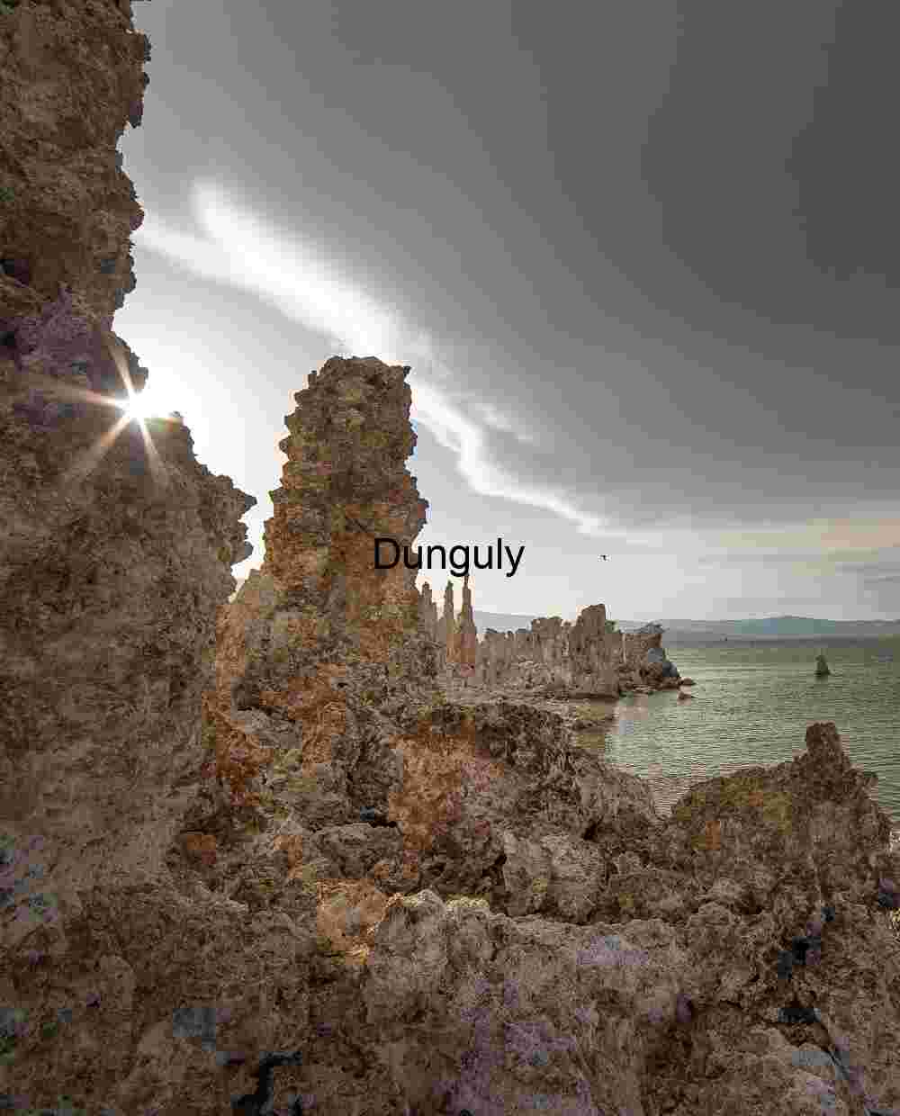 Radiant Divide: Tufa Towers and Flight Beneath a Stormlit Sky