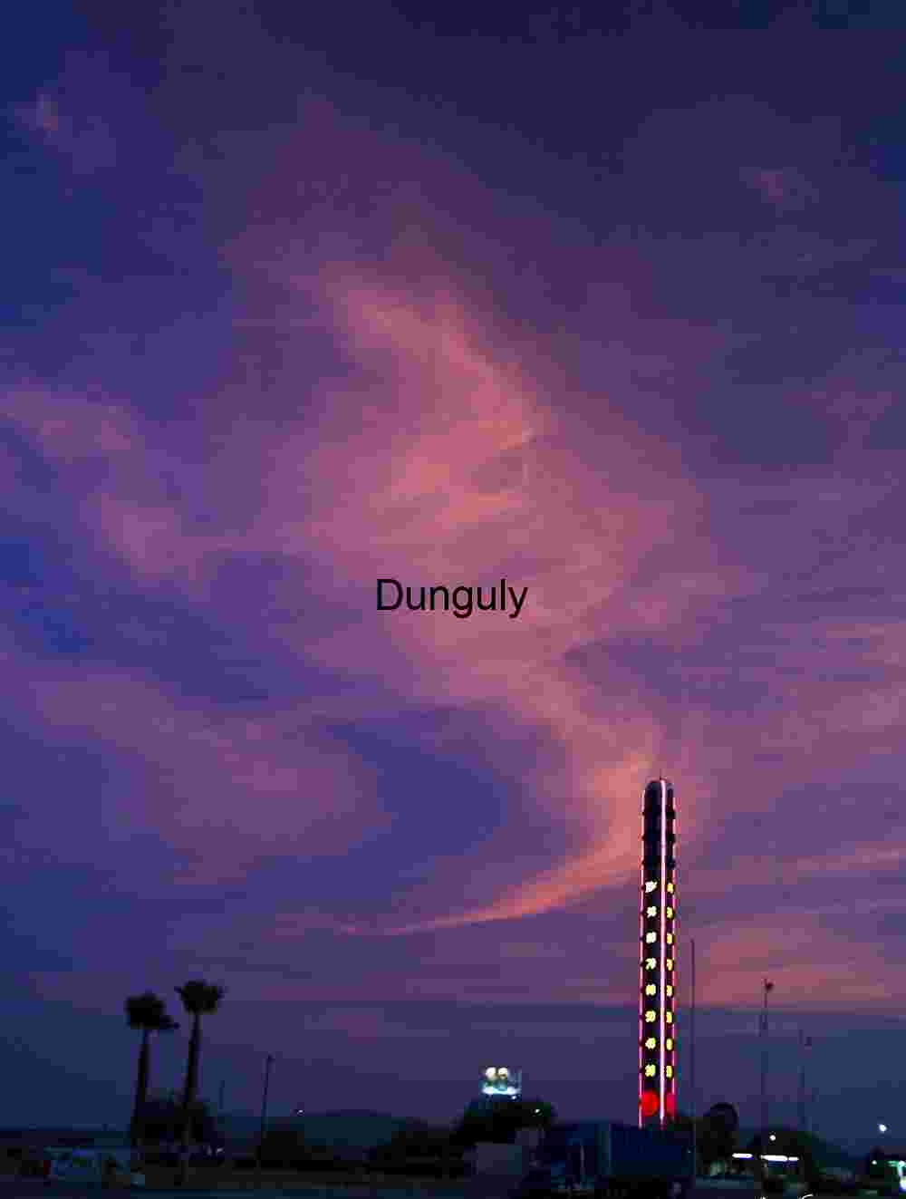 Desert Heat Rising: Iconic Thermometer Under a Fiery Sky