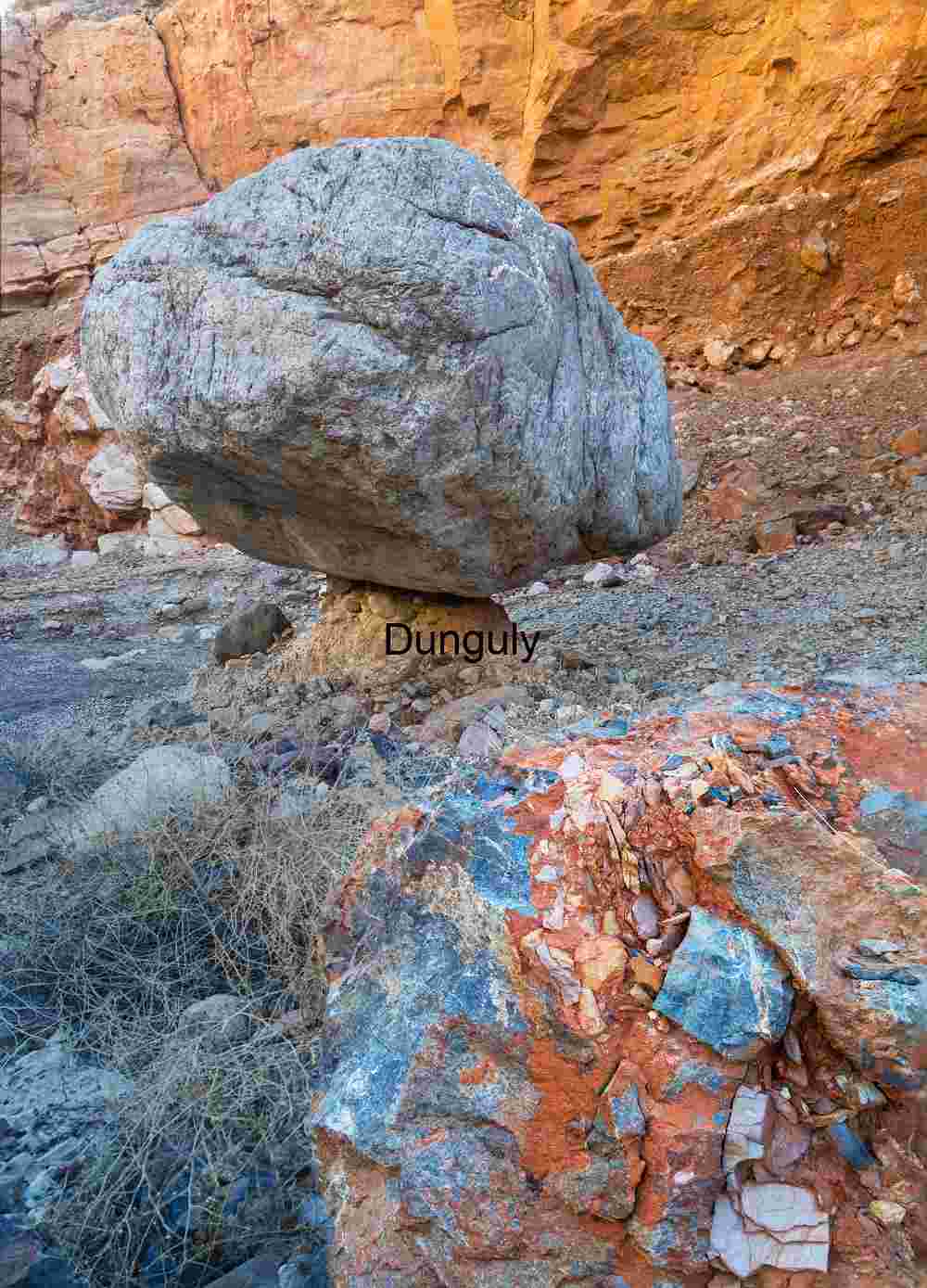 Balanced Rock and Colorful Boulder in Desert Canyon Landscape