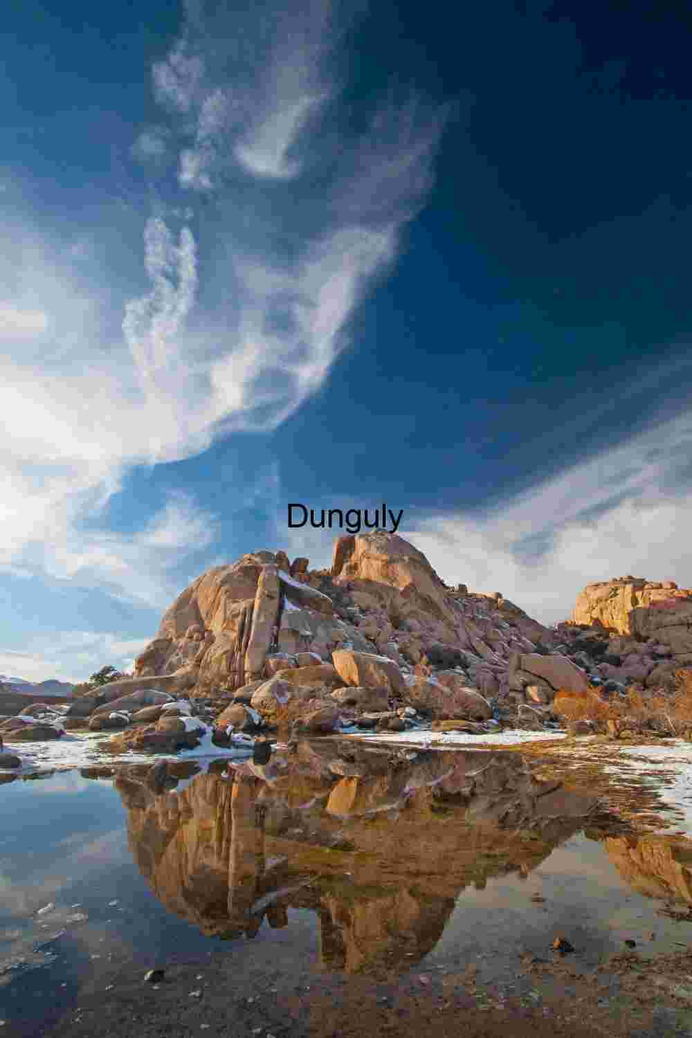 Stone and Sky: Snow-Dusted Rock Reflections in Desert Light