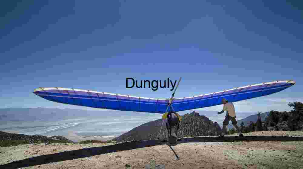 Adventure Sports in Mid‑Air — Hang Glider Silhouette Against Horizon