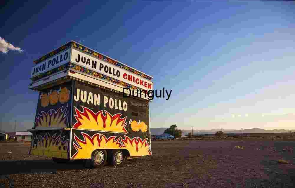Juan Pollo Food Trailer in Desert Landscape with Mountain Backdrop