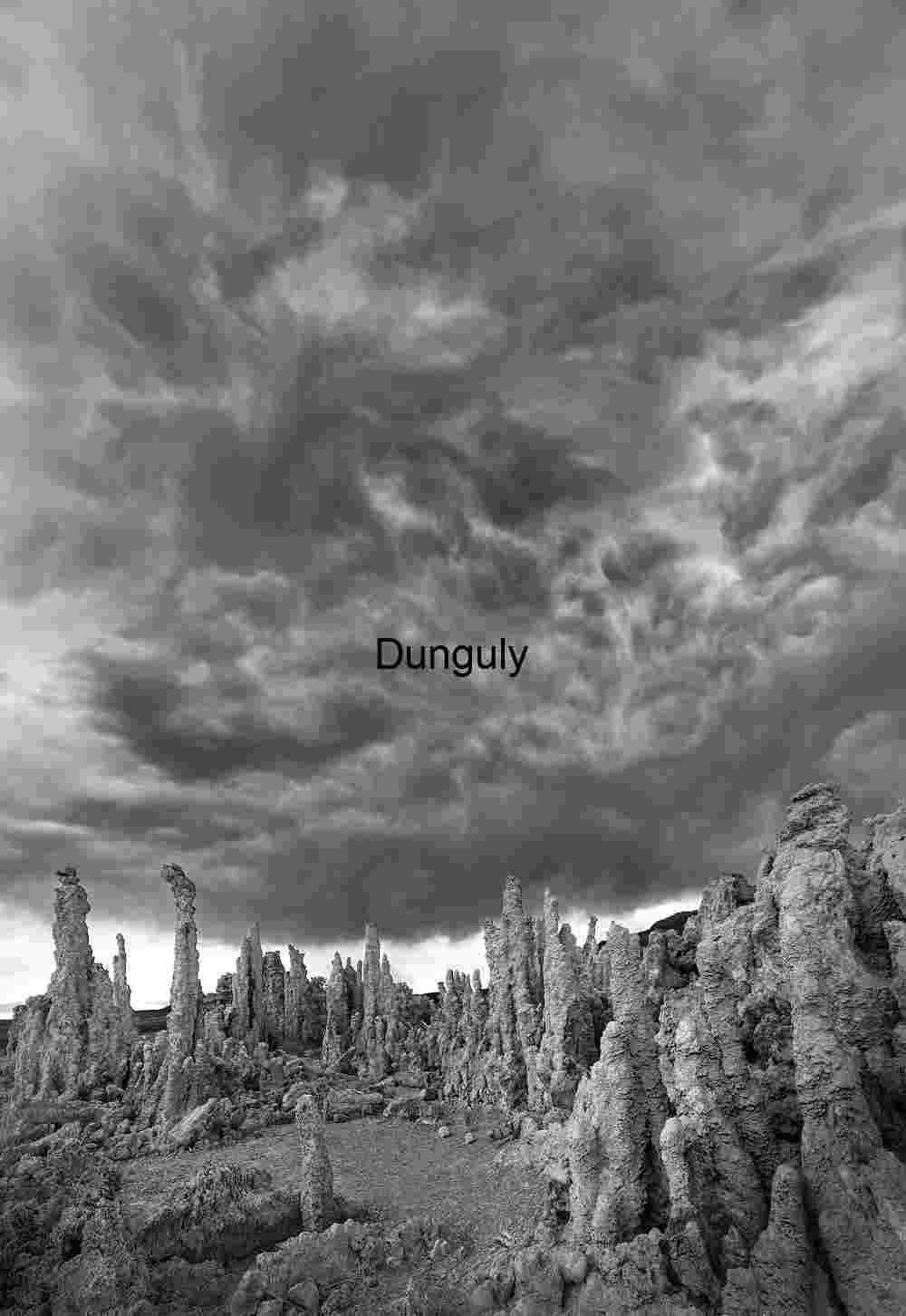 Stone and Storm: Tufa Towers Under Turbulent Skies