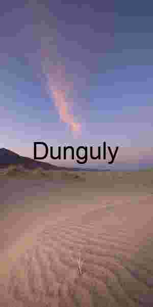 Rippled Desert Dunes at Sunrise Beneath Pink Cloud