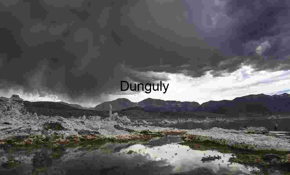 Stormfront Reflections: Salt Flat Pools Beneath Mountain Shadows