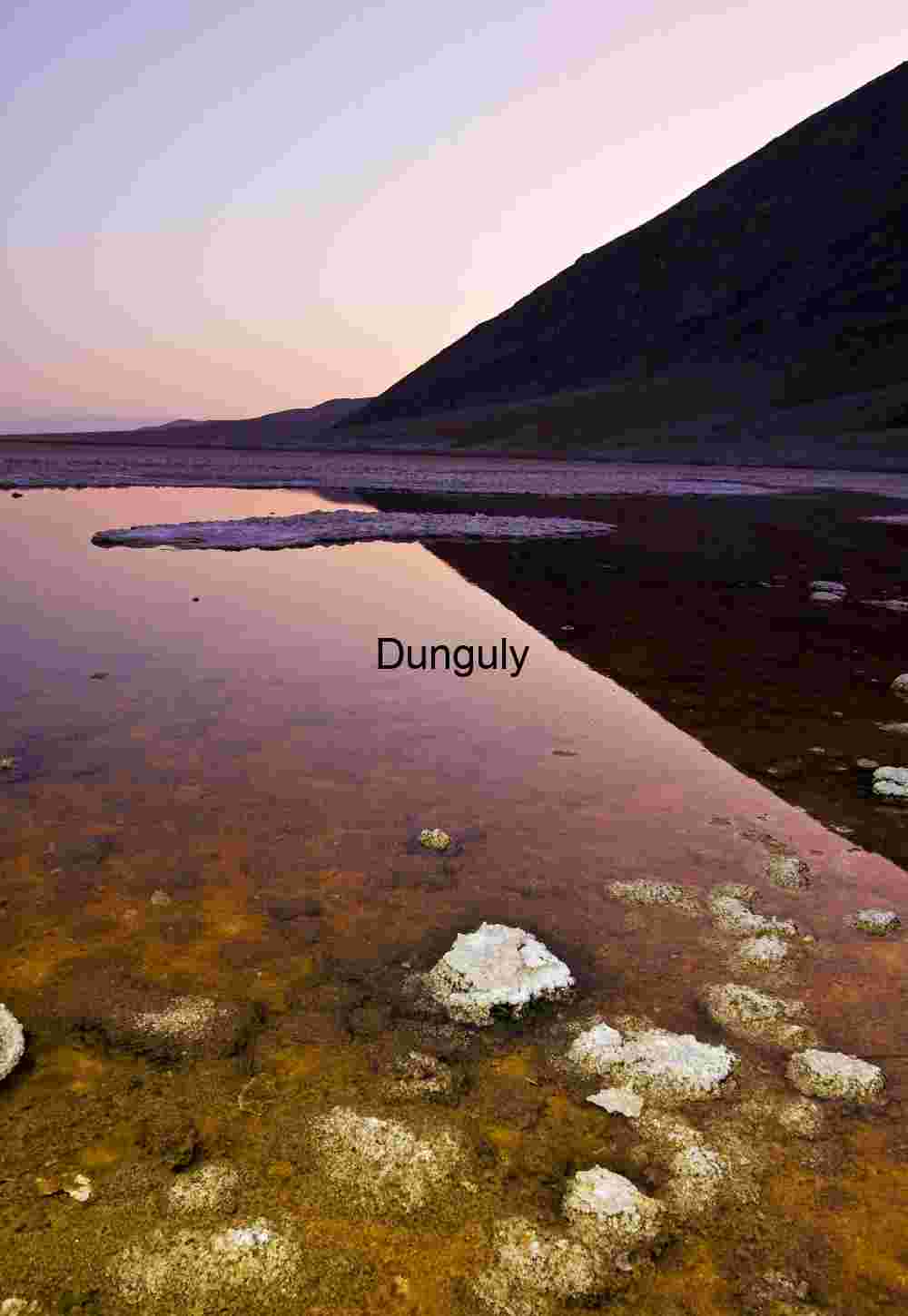 Reflections at Dusk: Salt Basin Beneath the Mountain’s Gaze