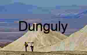 Traversing the Vastness: Hikers Amid Desert Peaks