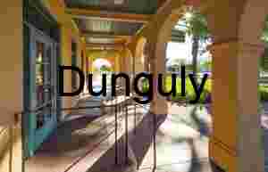 Sunlit Walkway with Arches and Ramp in Public Courtyard