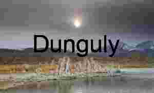 Veiled Light: Tufa Towers Framed by Alpine Storm