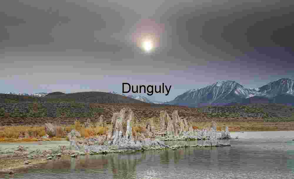 Veiled Light: Tufa Towers Framed by Alpine Storm