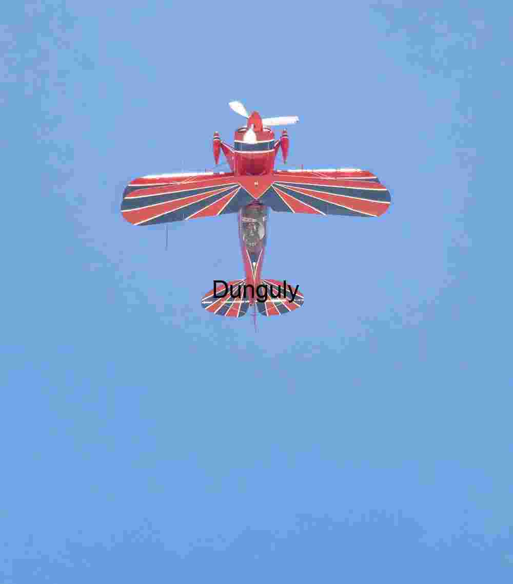Red Biplane in Clear Blue Sky Overhead View