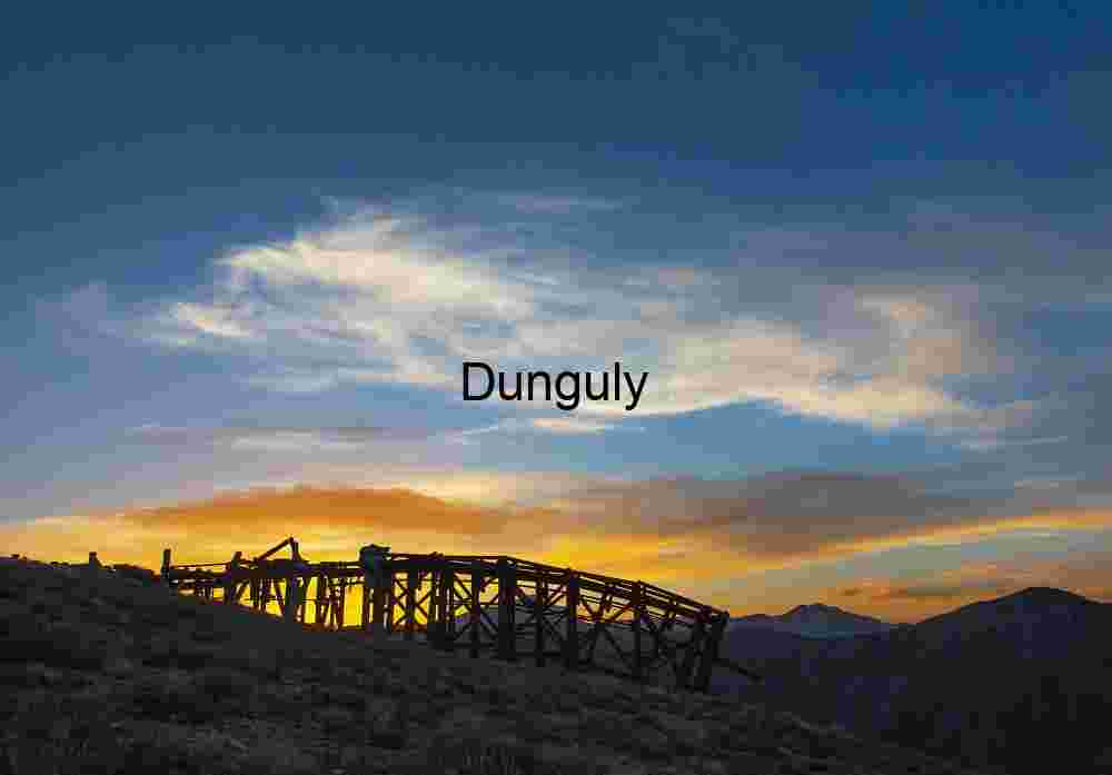 Sunset Silhouette of Abandoned Mining Structure on Mountain Ridge