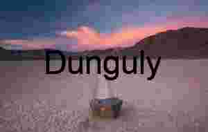 Looped Tire Tracks on Cracked Desert Playa Under Stormy Skies