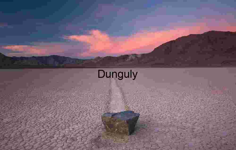 Looped Tire Tracks on Cracked Desert Playa Under Stormy Skies