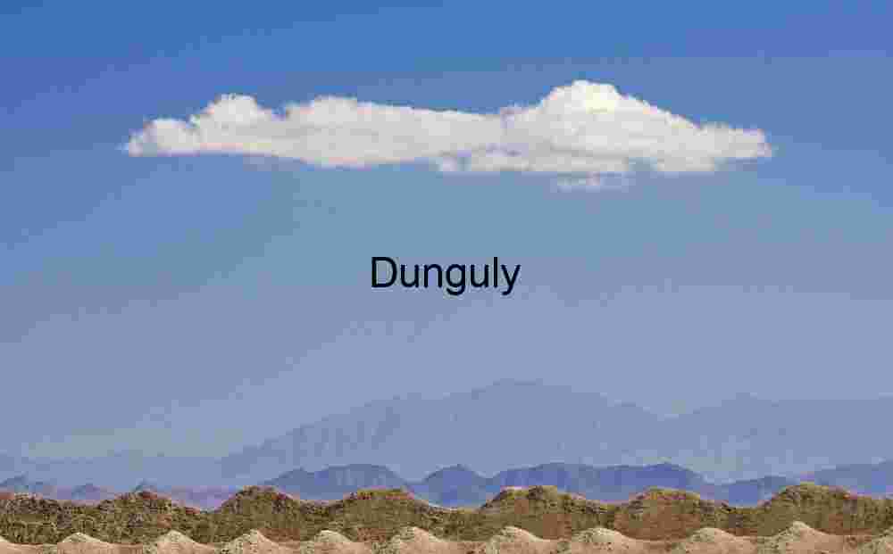 Layered Terrain and Elongated Cloud Over Distant Mountains