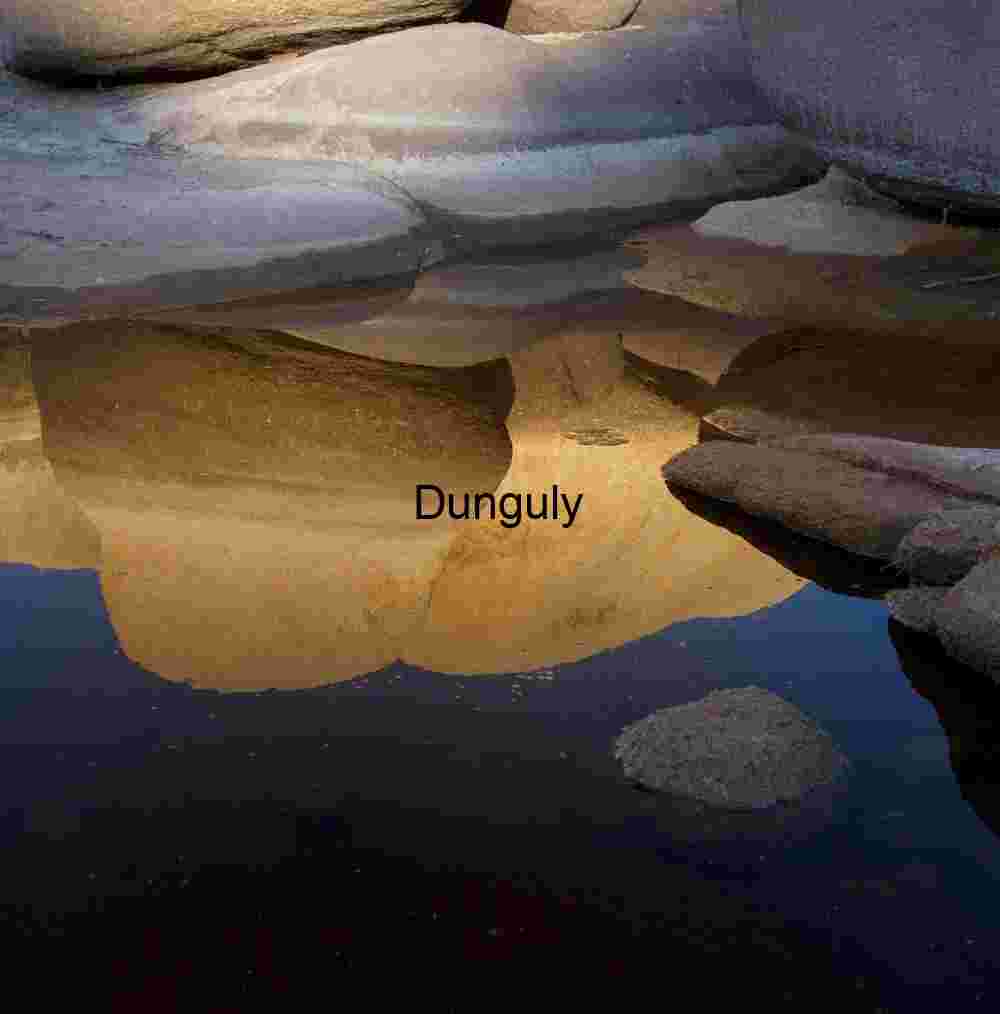 Erosion Echoes: Reflected Rock Forms in Desert Stillness