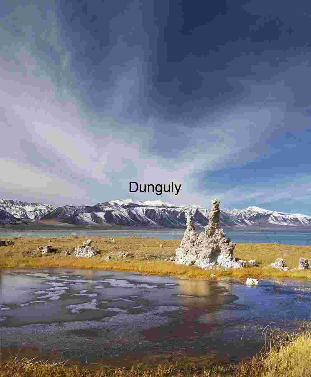 Frozen Mono Lake Tufa Towers with Sierra Nevada Mountains under Blue Sky
