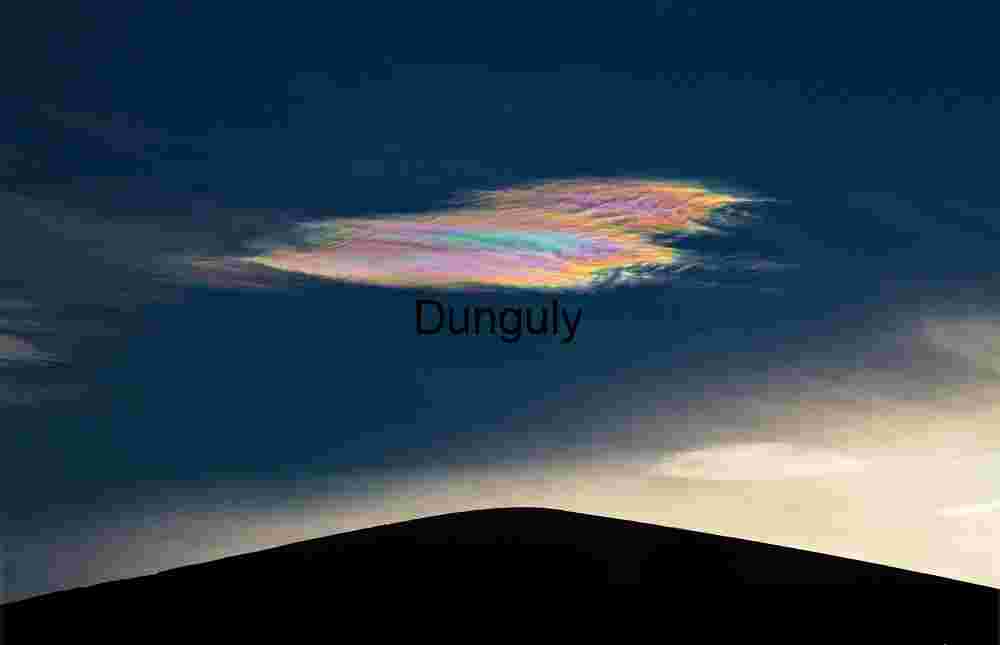 Spectral Drift: Nacreous Cloud Over Desert Silhouette