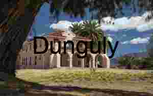 Historic Kelso Depot at Mojave National Preserve with Palm Trees and Mountains