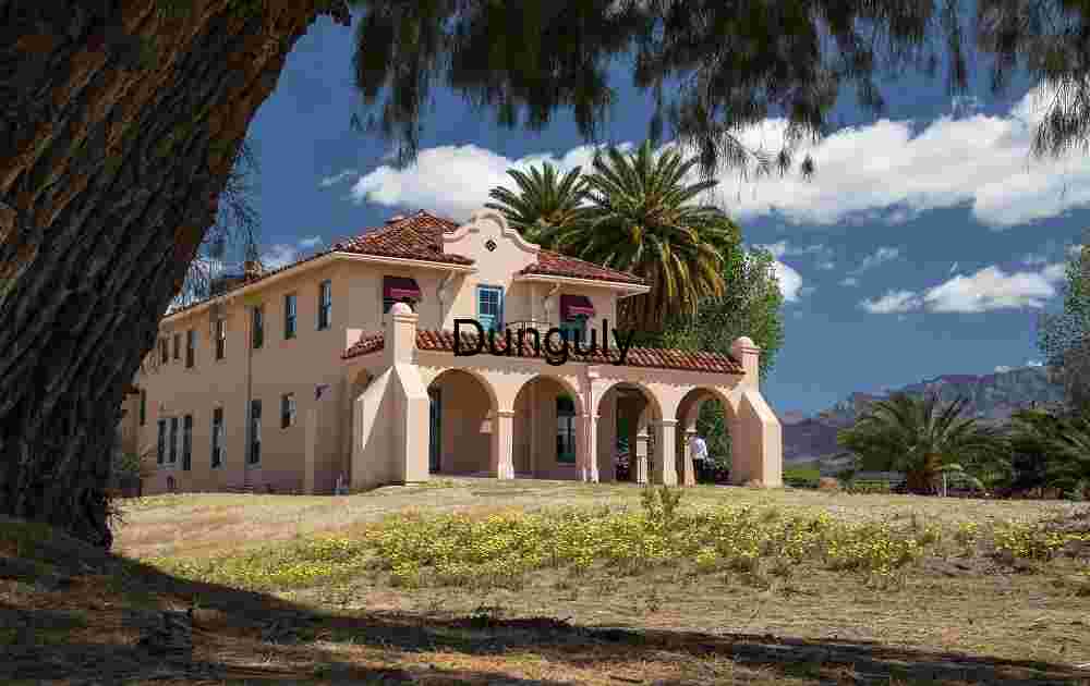 Historic Kelso Depot at Mojave National Preserve with Palm Trees and Mountains