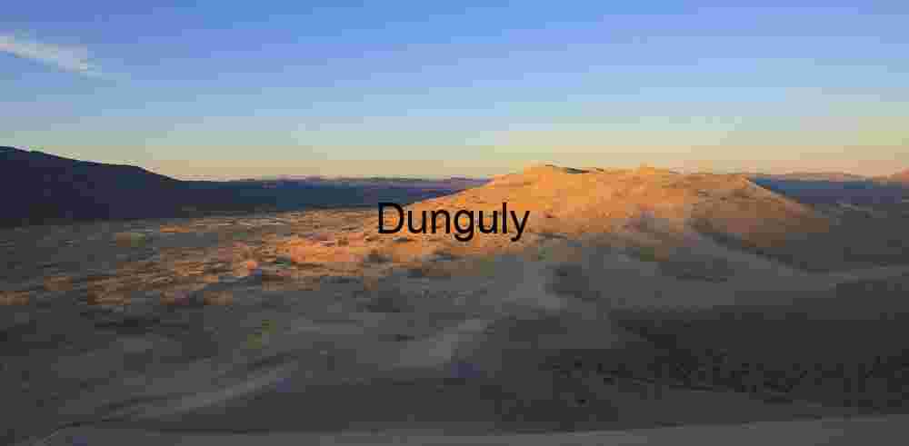 Sunlit Desert Dunes and Mountain Horizon at Golden Hour