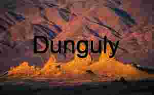 Golden Spires Rising from Desert Floor at Sunset