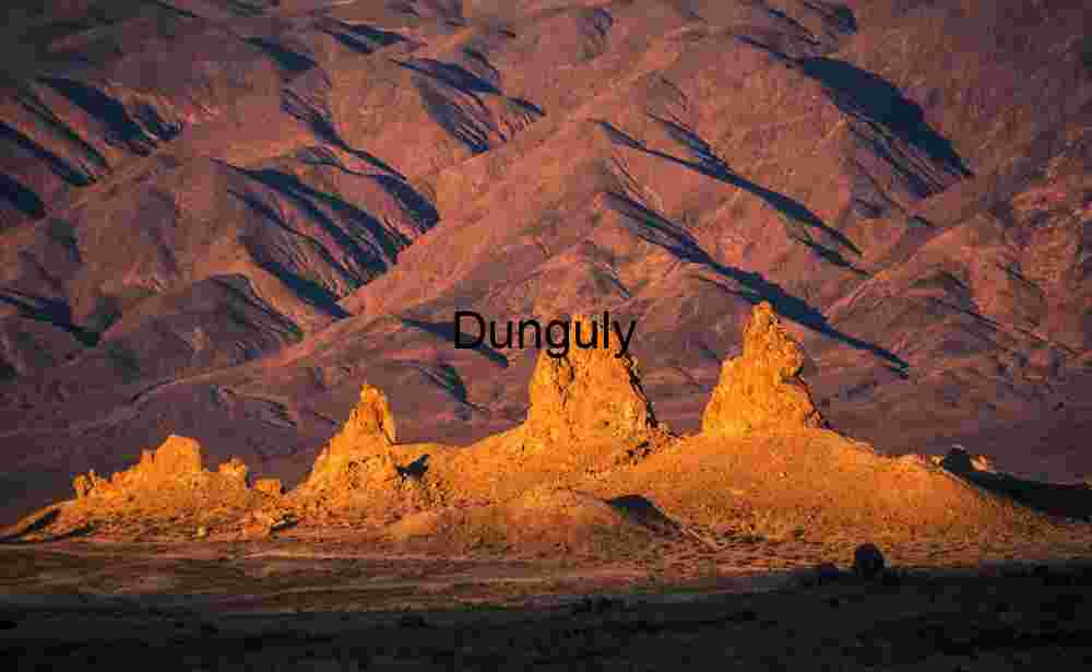 Golden Spires Rising from Desert Floor at Sunset