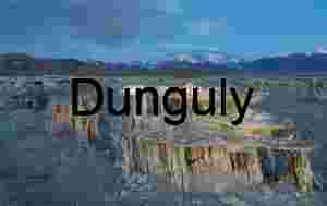 Erosion and Elevation: Tufa Towers Framed by Snow-Capped Peaks