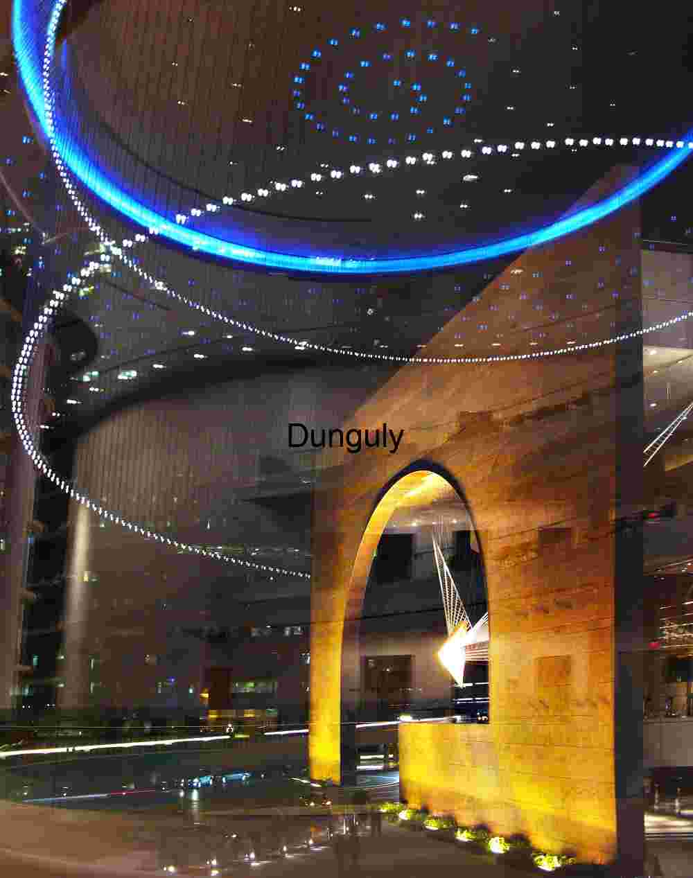Futuristic Interior with Illuminated Archway and Spiral Ceiling Lights
