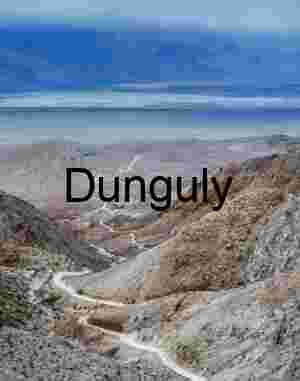 Winding Dirt Road Through Rugged Desert Mountains