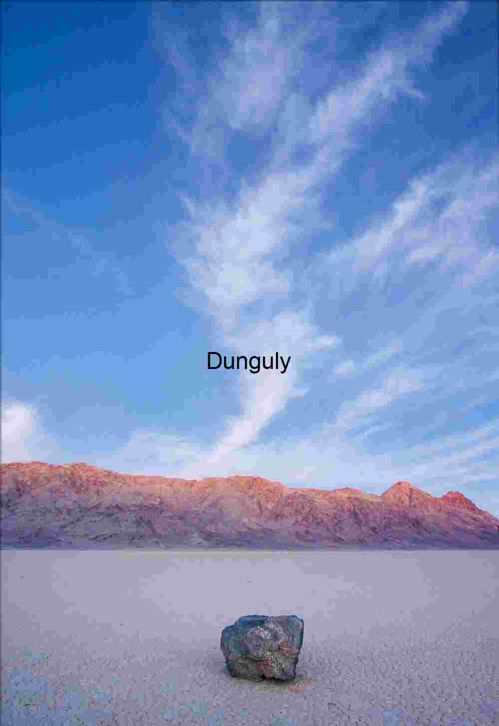 Circular Tracks Leading to a Distant Object Amidst Rugged Mountains